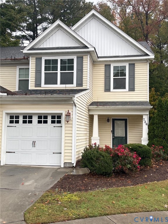 View of front of property with an attached garage,