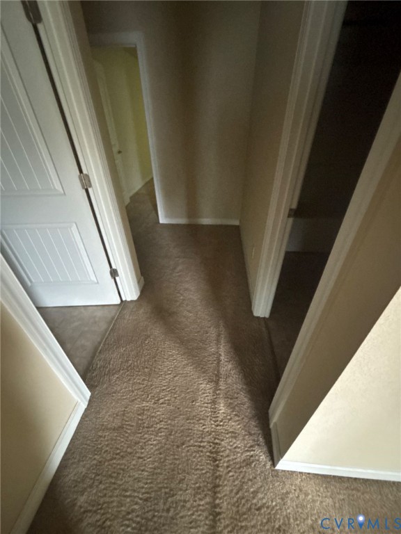 726 Albertine Court Chesapeake, VA 23320 - Photo 18 of 21 Hallway featuring dark carpet and baseboards