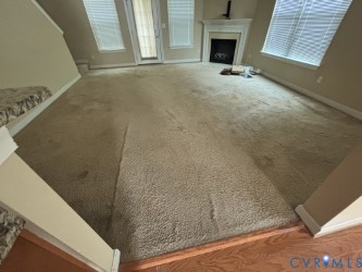 726 Albertine Court Chesapeake, VA 23320 - Photo 6 of 21 Unfurnished living room featuring carpet and a fir