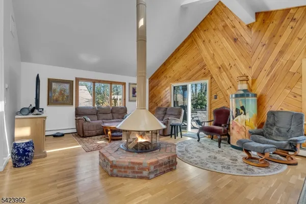 a kitchen with stainless steel appliances granite countertop a stove a sink dishwasher and cabinets with wooden floor