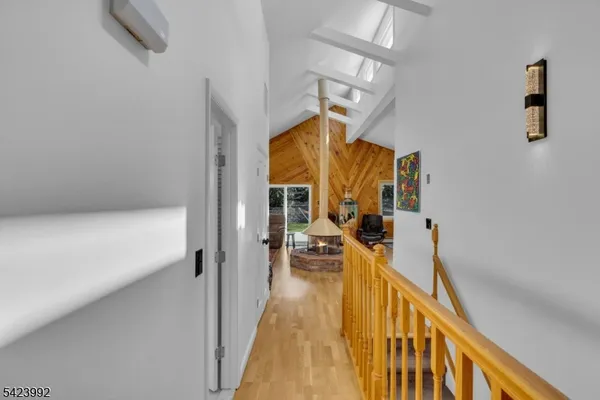 a view of balcony with wooden floor and outdoor seating