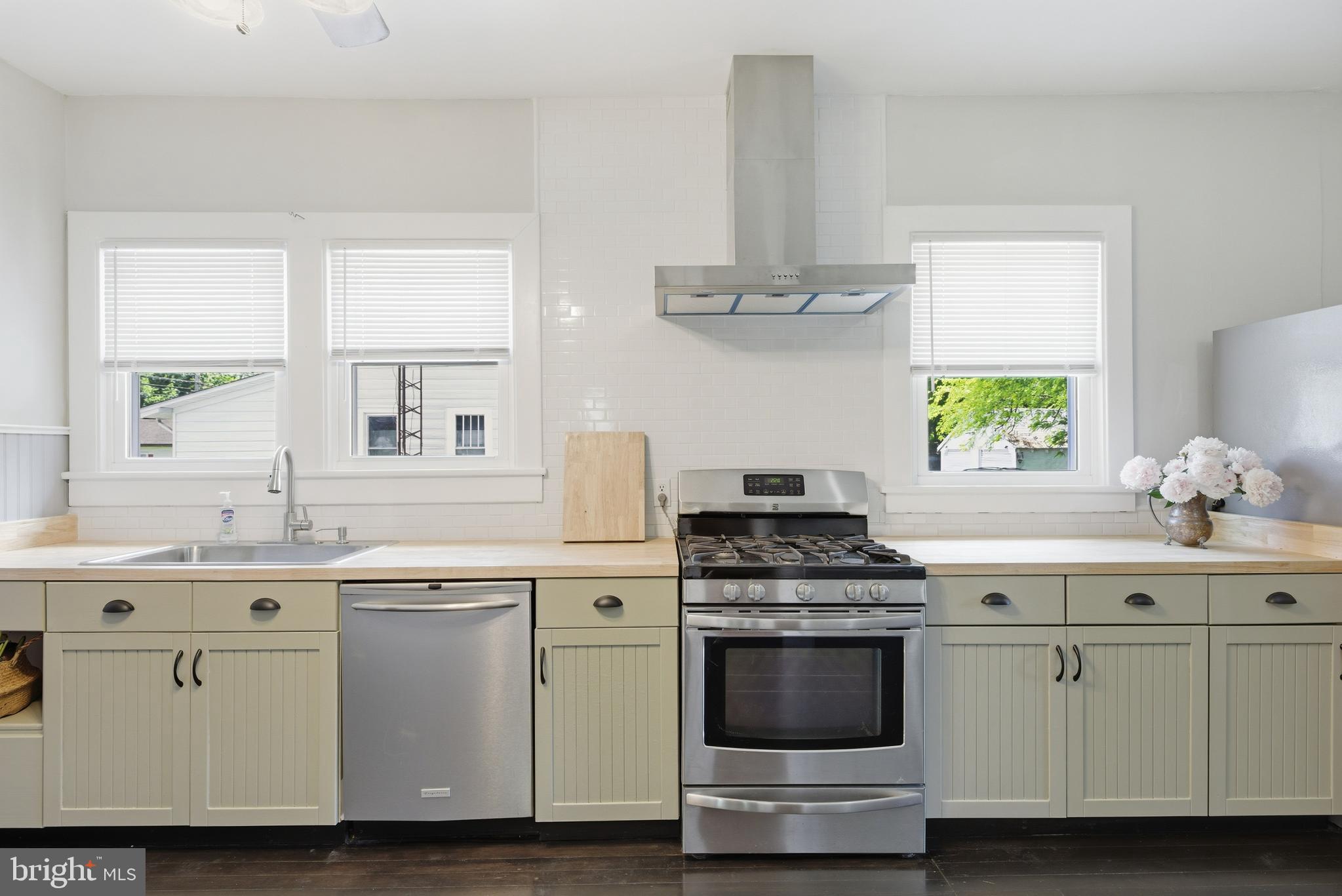 106 Main Street Preston, MD 21655 - Photo 7 of 31 a kitchen with cabinets appliances and a window