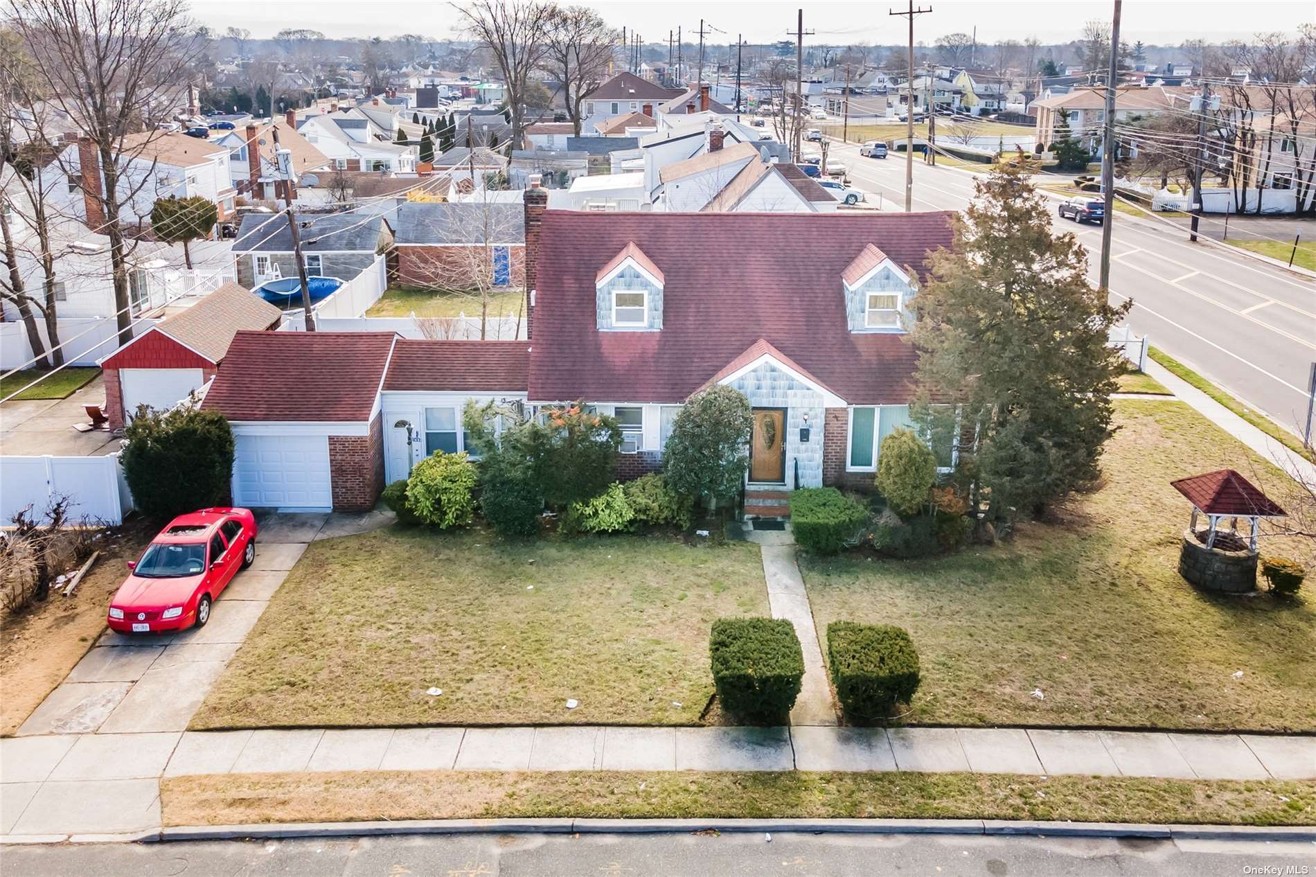 1622 Wells Road Valley Stream, NY 11580 - Photo 1 of 1 an aerial view of residential houses with outdoor space and parking