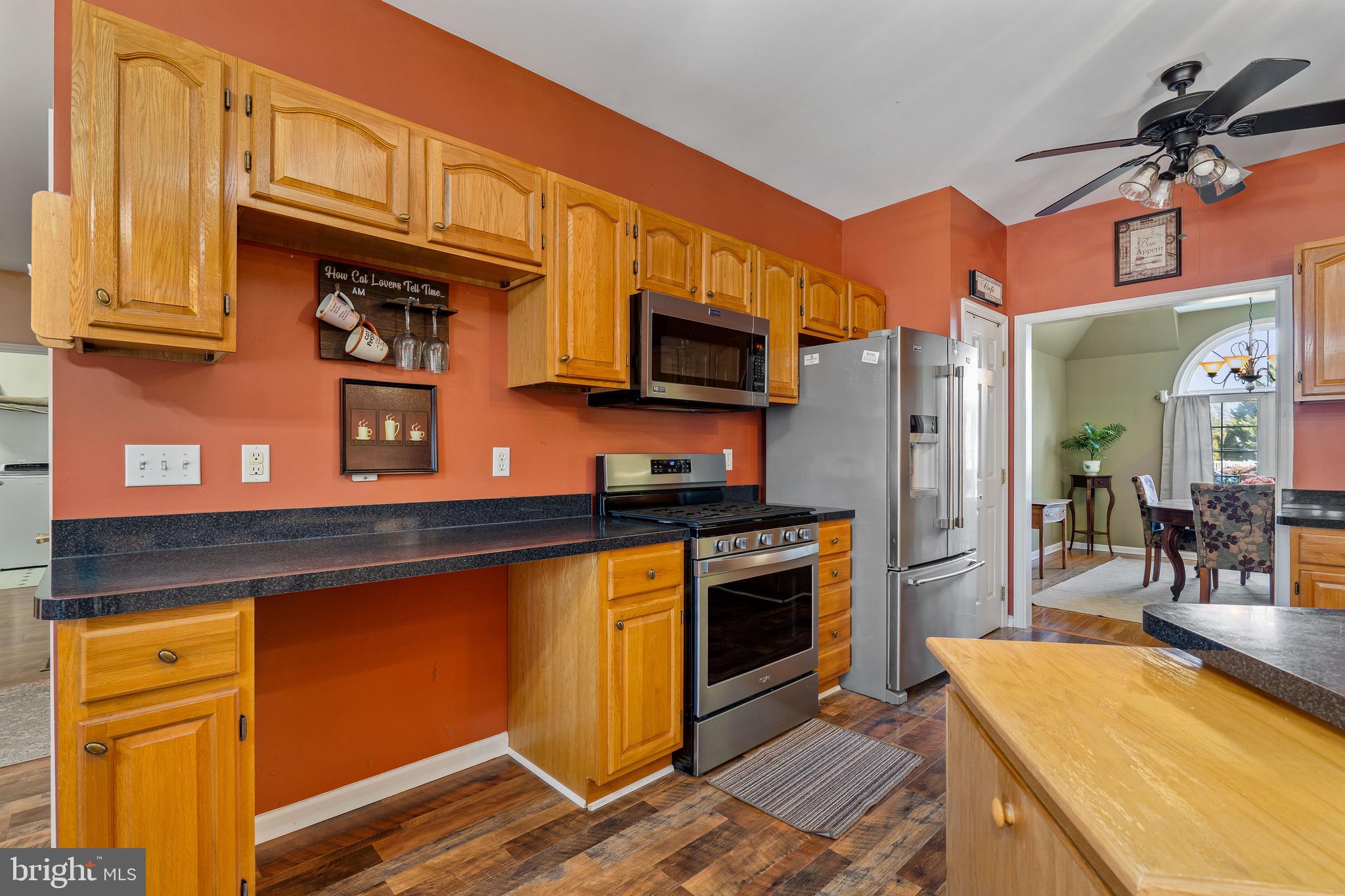 7 Club Lane Earleville, MD 21919 - Photo 21 of 48 a kitchen with stainless steel appliances granite countertop a refrigerator stove top oven and sink