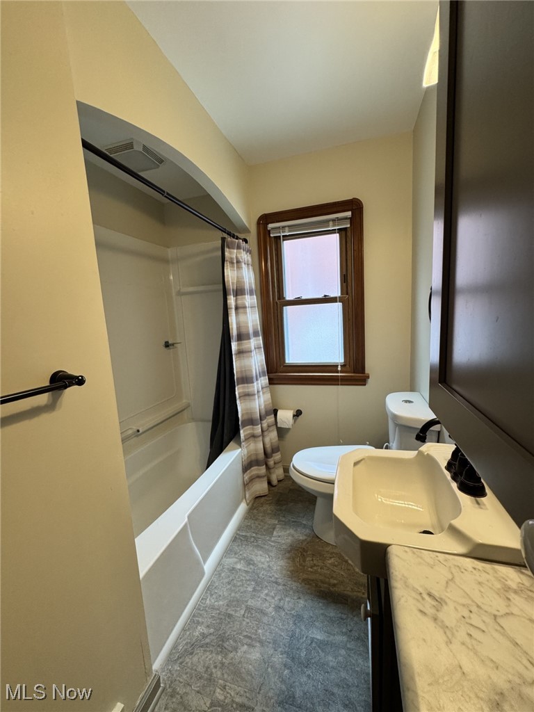 3712 Snow Road Cleveland, OH 44134 - Photo 21 of 40 Bathroom with shower / tub combo with curtain and vanity