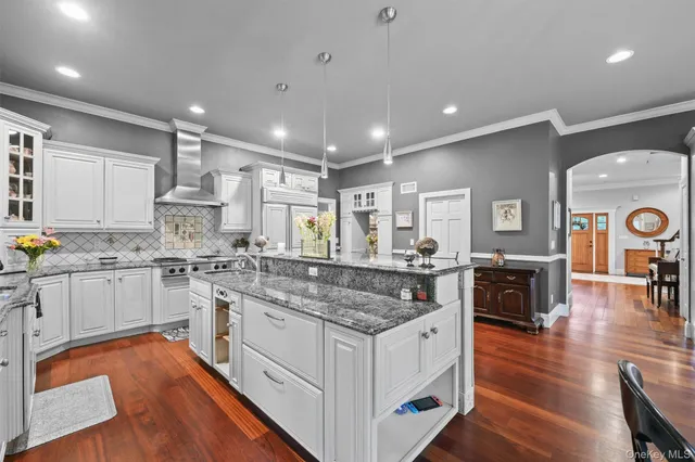 a kitchen with stainless steel appliances granite countertop a stove and a sink