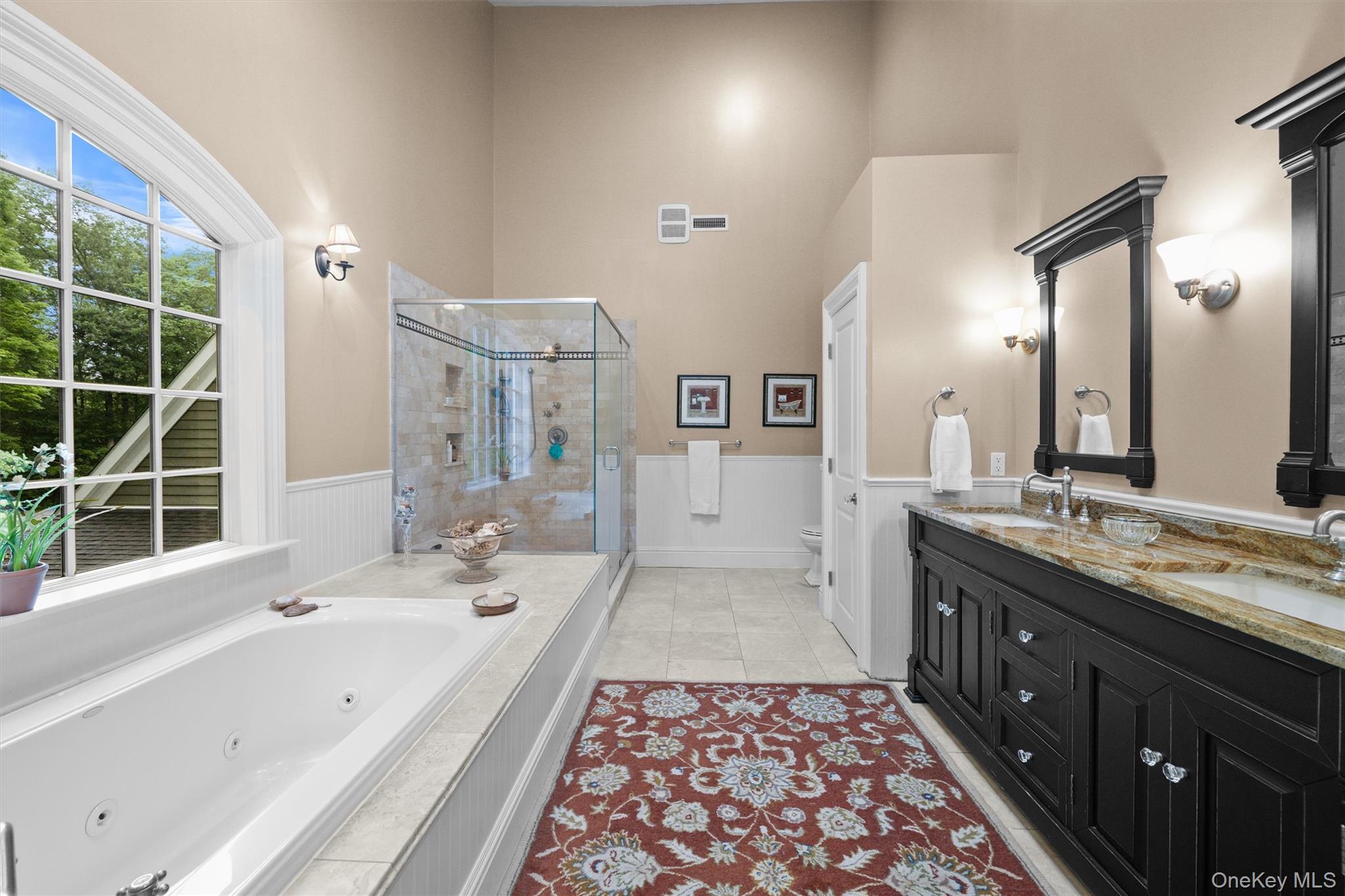 383 Illington Road Ossining, NY 10562 - Photo 25 of 50 a spacious bathroom with a bathtub sink and mirror