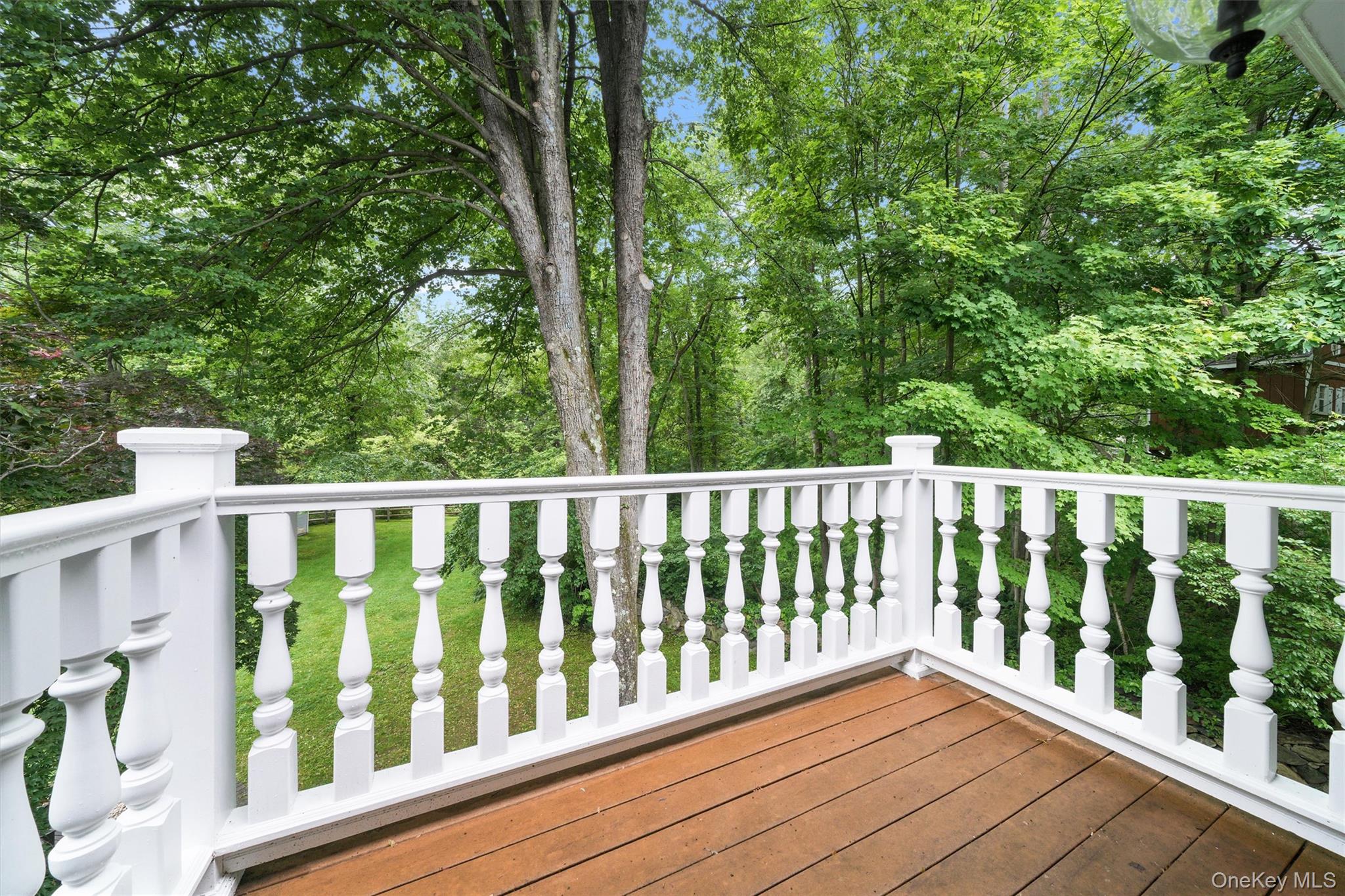 383 Illington Road Ossining, NY 10562 - Photo 27 of 50 a balcony with wooden floor and fence