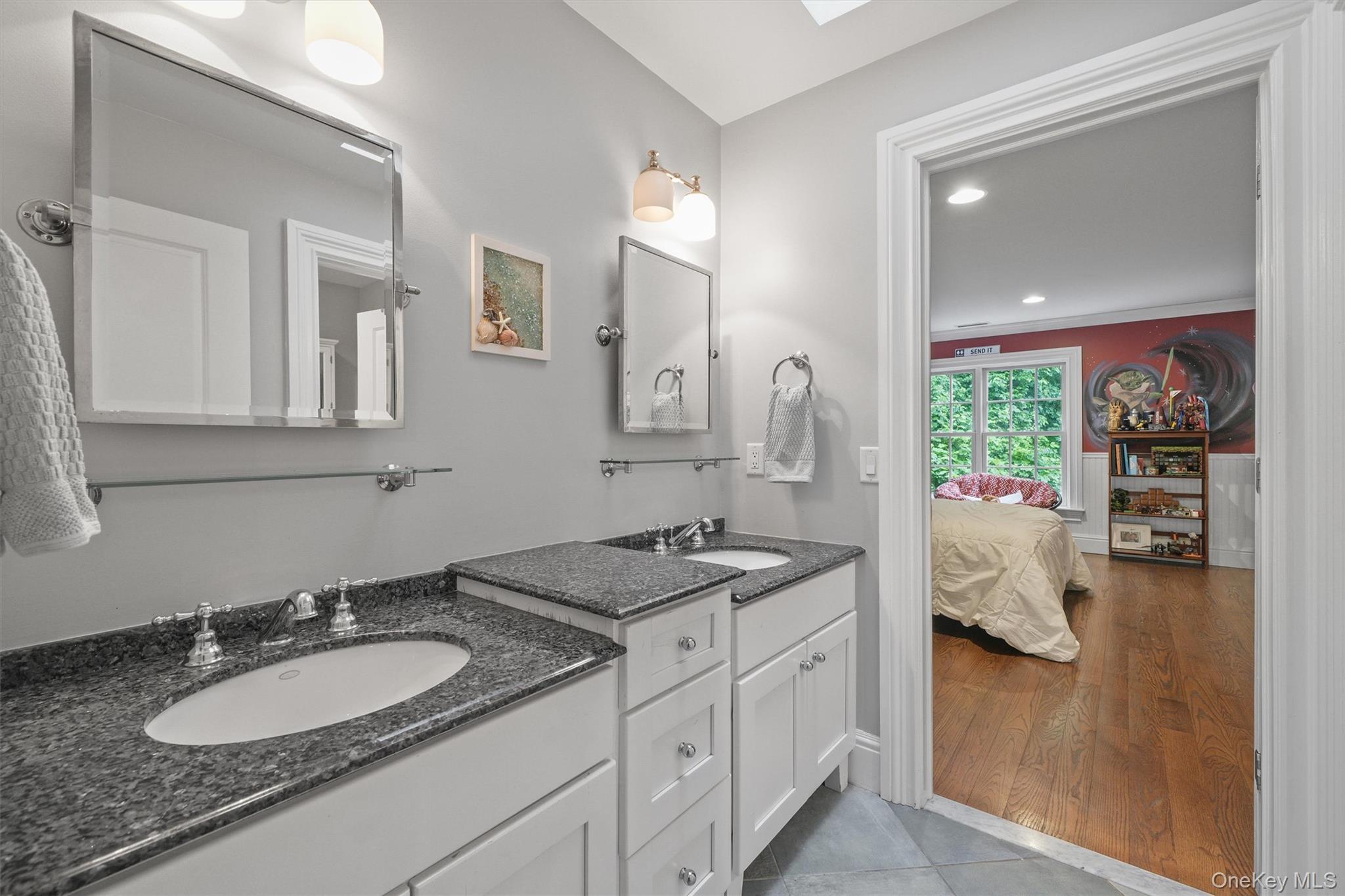383 Illington Road Ossining, NY 10562 - Photo 28 of 50 a en suite bathroom with a granite countertop sink and a mirror