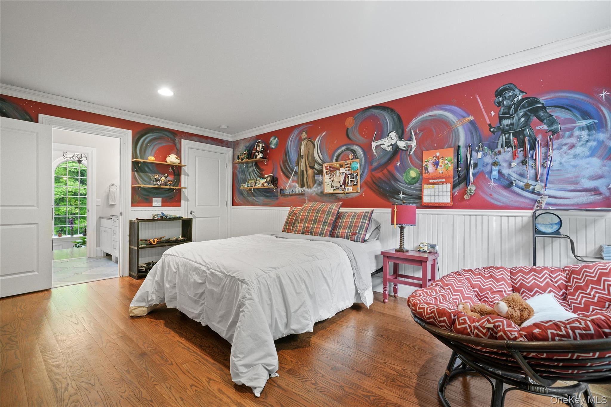 383 Illington Road Ossining, NY 10562 - Photo 31 of 50 a bedroom with a bed and dresser with wooden floor