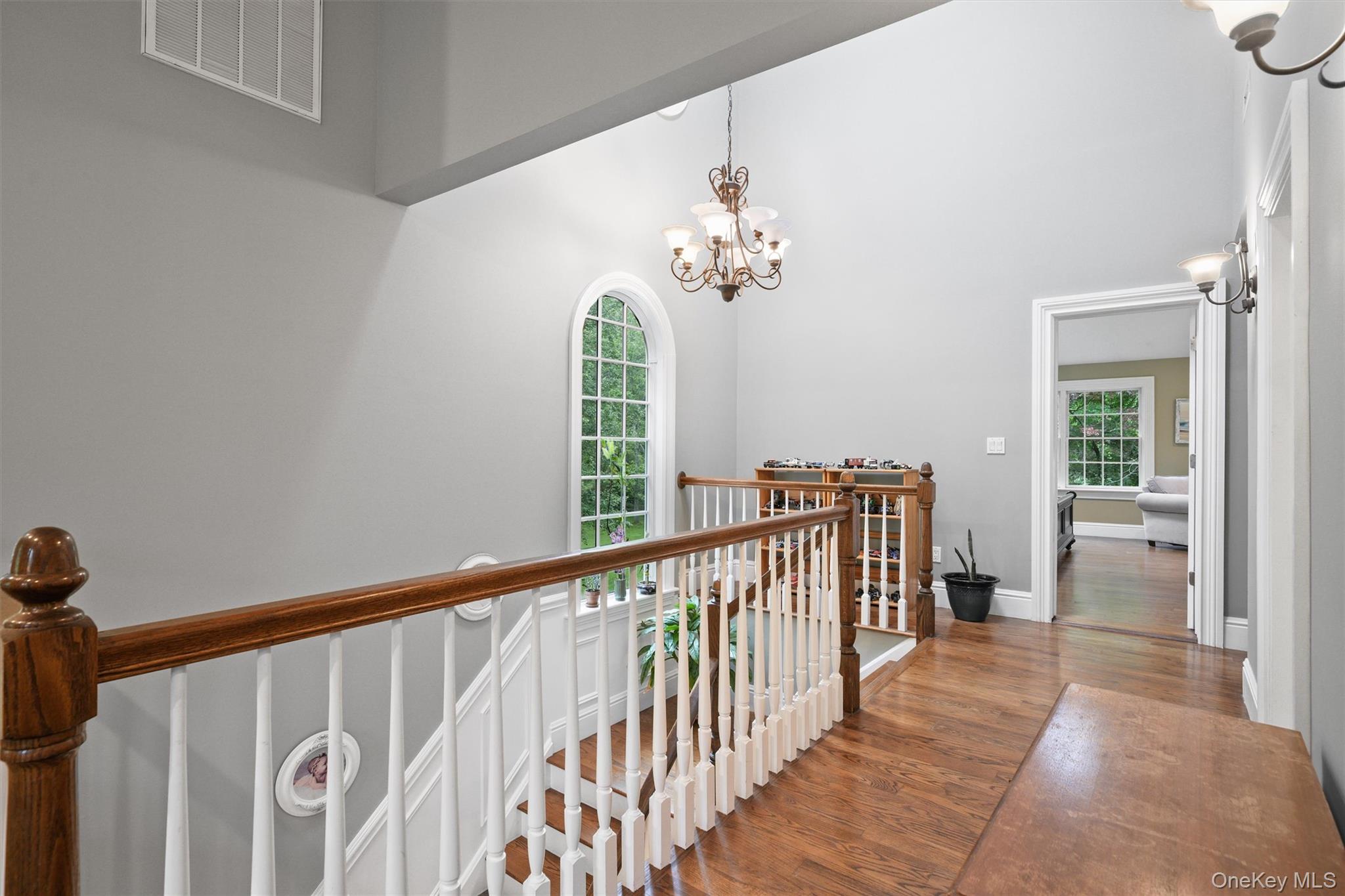 383 Illington Road Ossining, NY 10562 - Photo 32 of 50 a view of a hallway with wooden floor and windows