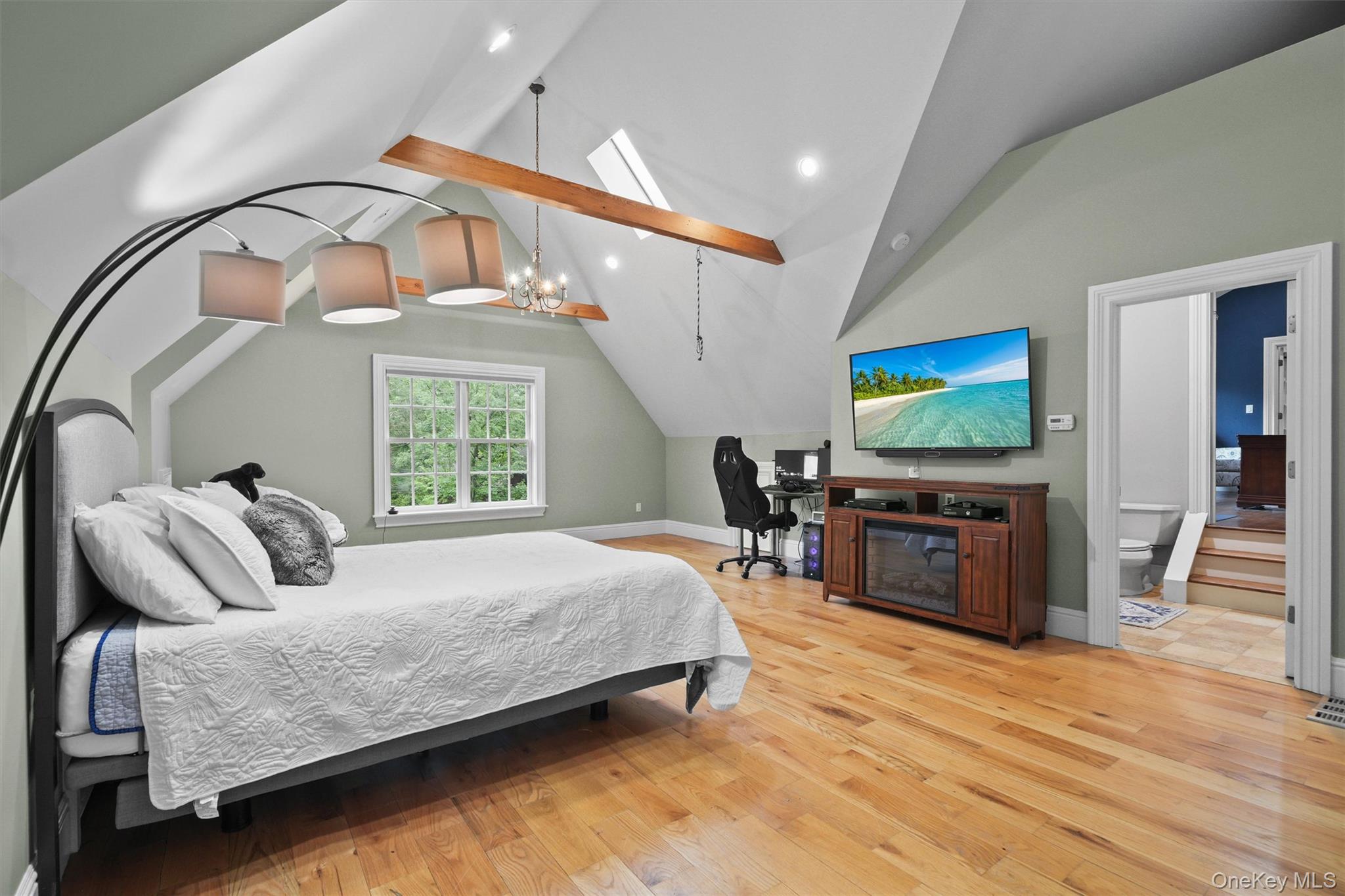 383 Illington Road Ossining, NY 10562 - Photo 41 of 50 a bedroom with a bed and a flat screen tv