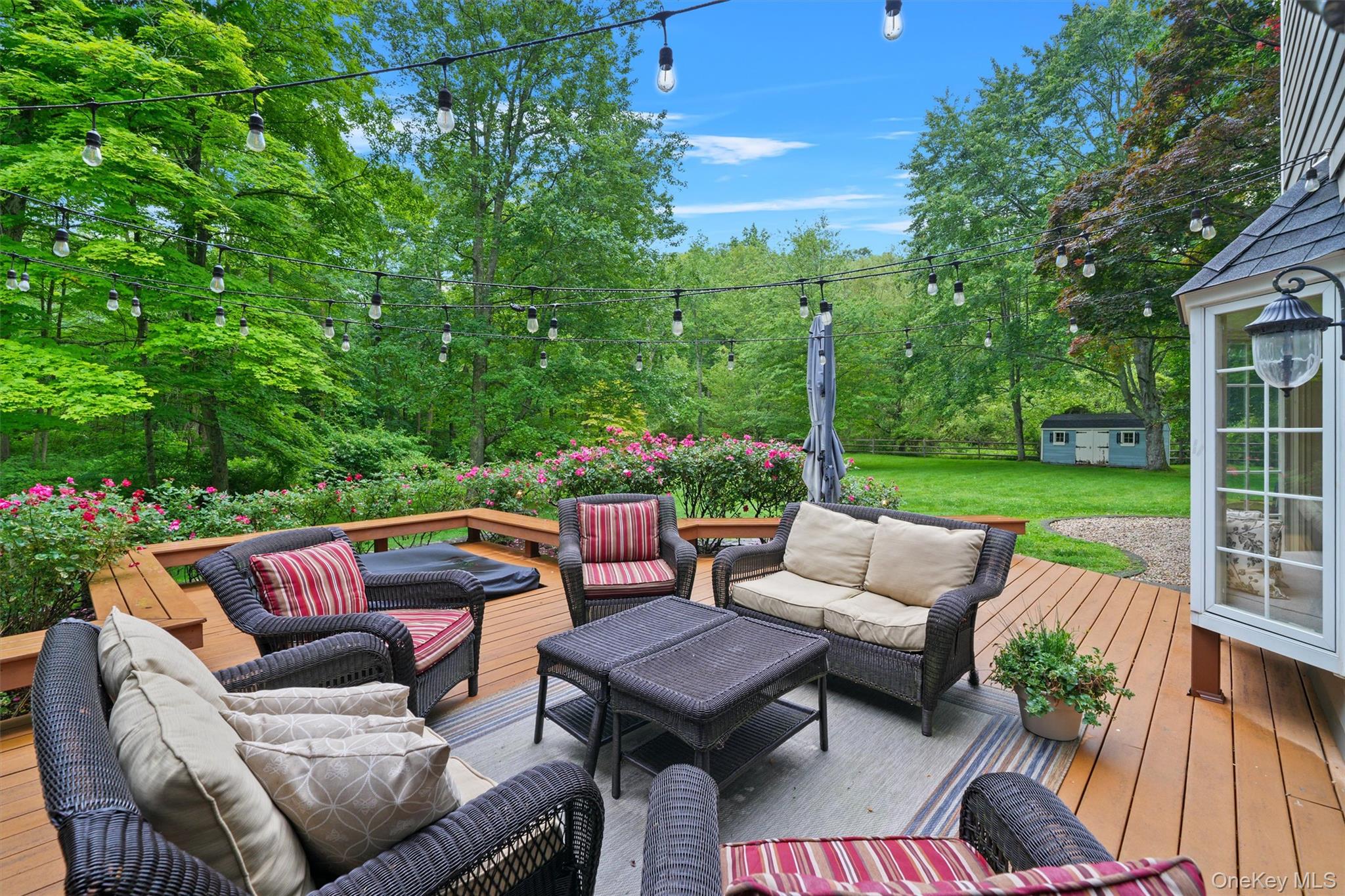 383 Illington Road Ossining, NY 10562 - Photo 42 of 50 a view of a patio with couches chairs and a fire pit