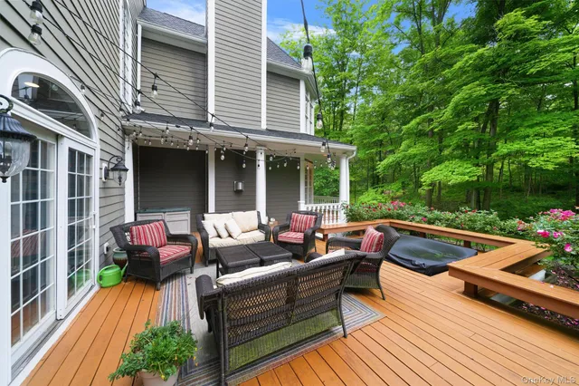 a view of a patio with couches and potted plants