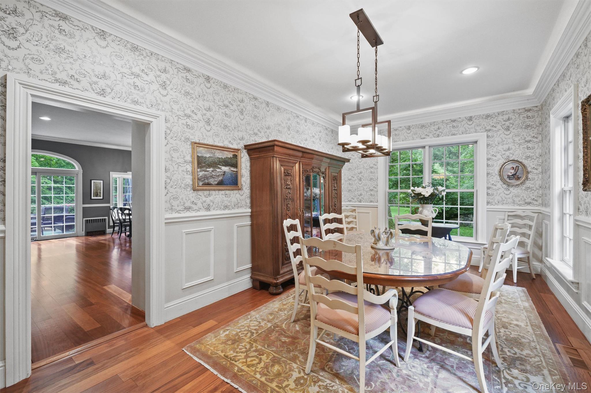 383 Illington Road Ossining, NY 10562 - Photo 10 of 50 a dining room with furniture a chandelier and wooden floor