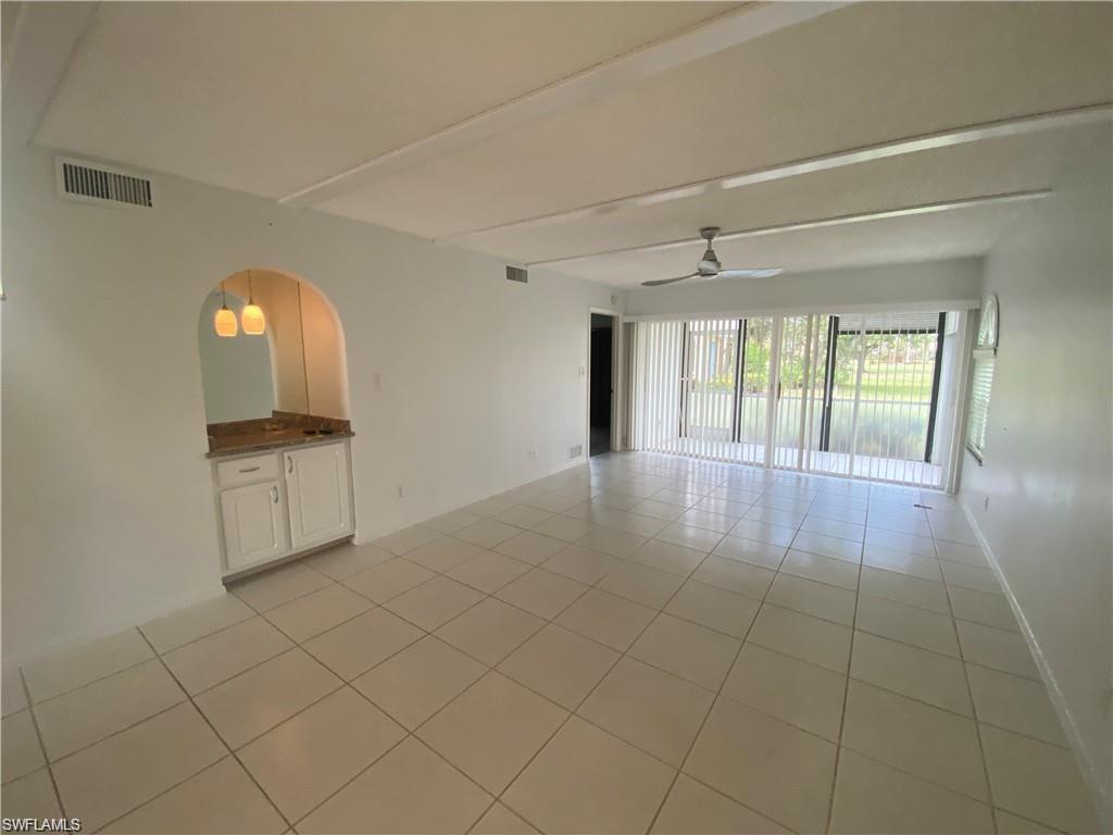 705 Augusta Boulevard, Unit 7055 Naples, FL 34113 - Photo 6 of 18 a view of a room and window