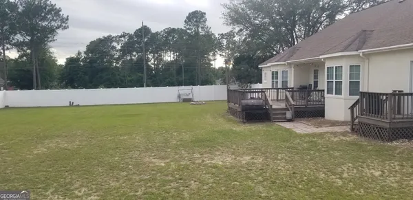 a backyard of a house with lots of green space