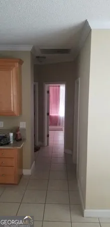 a kitchen with stainless steel appliances granite countertop a refrigerator stove and sink