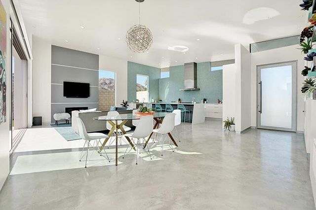 a view of a livingroom with furniture and a flat screen tv