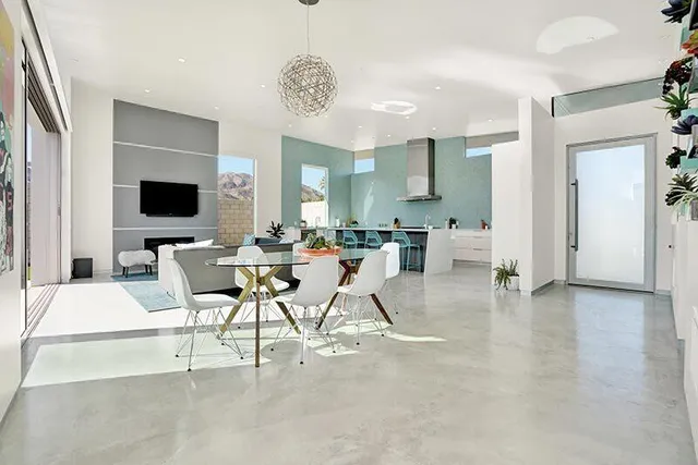 a view of a livingroom with furniture and a flat screen tv