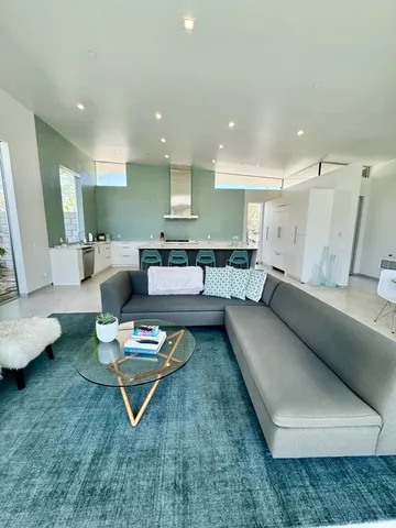 a living room with furniture and a rug