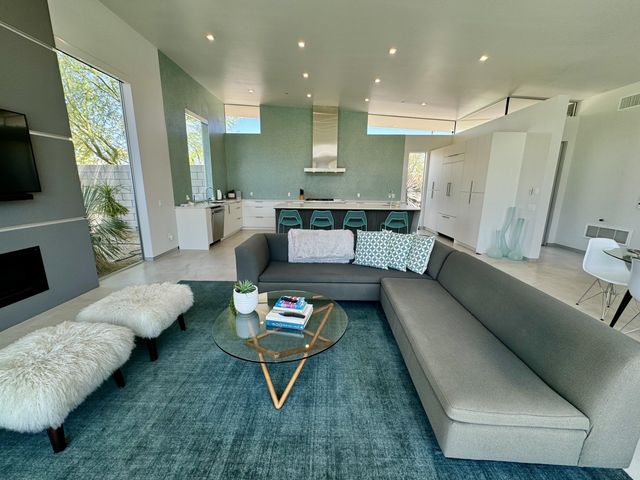 a living room with furniture and a rug