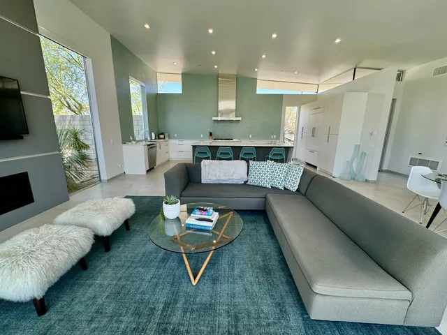 a living room with furniture and a rug