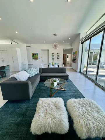 a living room with furniture and a rug
