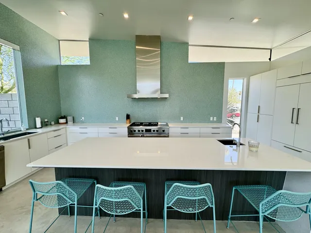 a kitchen with a table and chairs in it