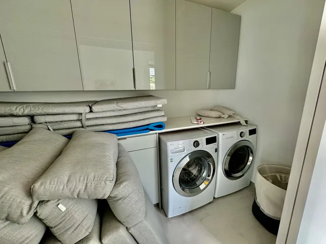 a utility room with dryer and washer