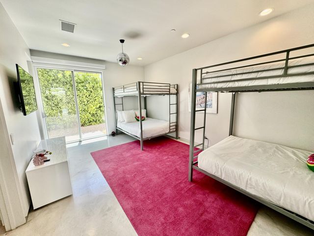 a bedroom with a bed and a couch