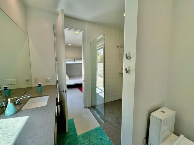 a bathroom with a tub sink and toilet
