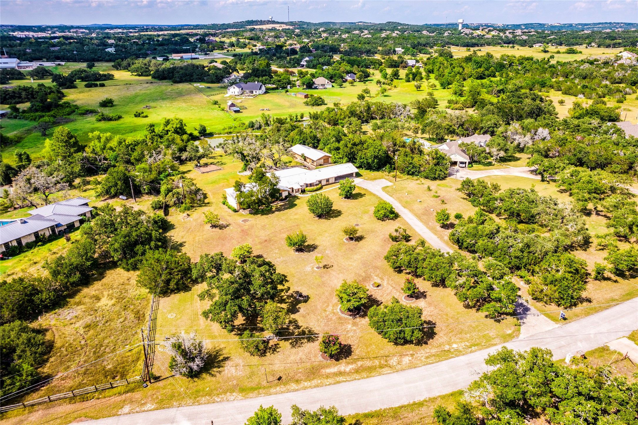 301 Springwood Road Dripping Springs, TX 78620 - Photo 1 of 1 Welcome to 301 Springwood Rd. -- a rare 3 acre lot in one of Dripping Springs' most beloved neighborhoods--Springwood.
