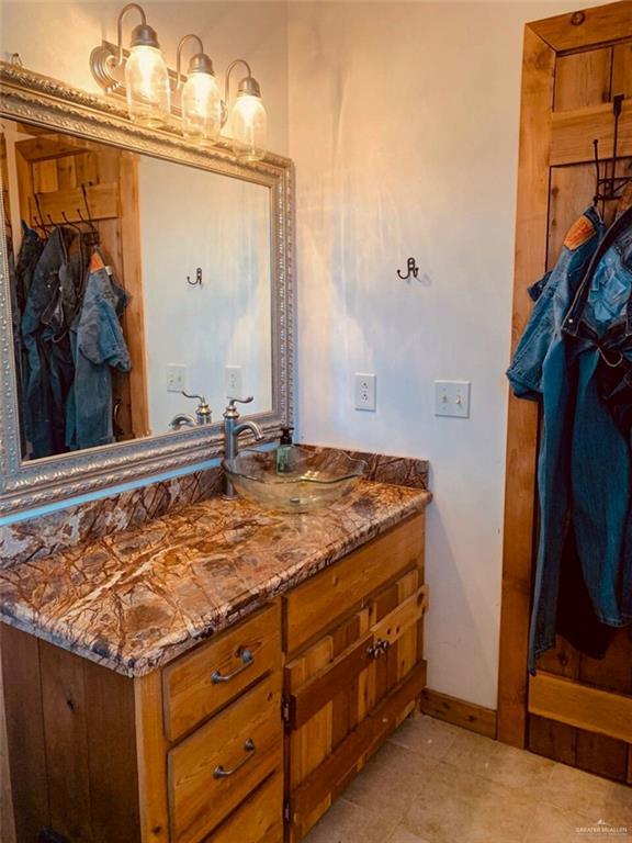 2938 Highway 83 Roma, TX 78584 - Photo 13 of 23 Bathroom with vanity and light tile patterned floors
