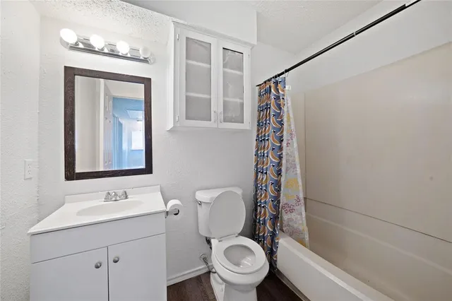 a bathroom with a toilet a sink and a shower