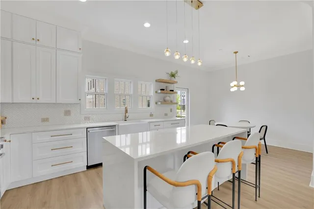 a dining room with furniture and wooden floor