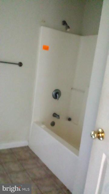 13765 Point Lookout Road Ridge, MD 20680 - Photo 12 of 15 a bathroom with a bathtub