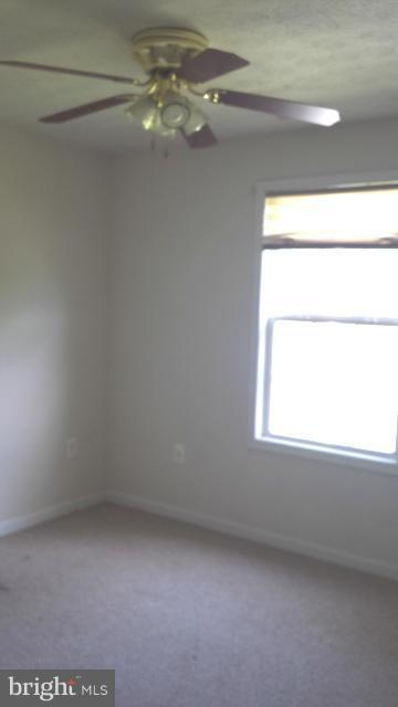 13765 Point Lookout Road Ridge, MD 20680 - Photo 9 of 15 a view of an empty room with a window