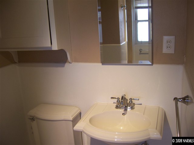 761 West Street Reno, NV 89503 - Photo 7 of 13 a bathroom with a sink a toilet and mirror