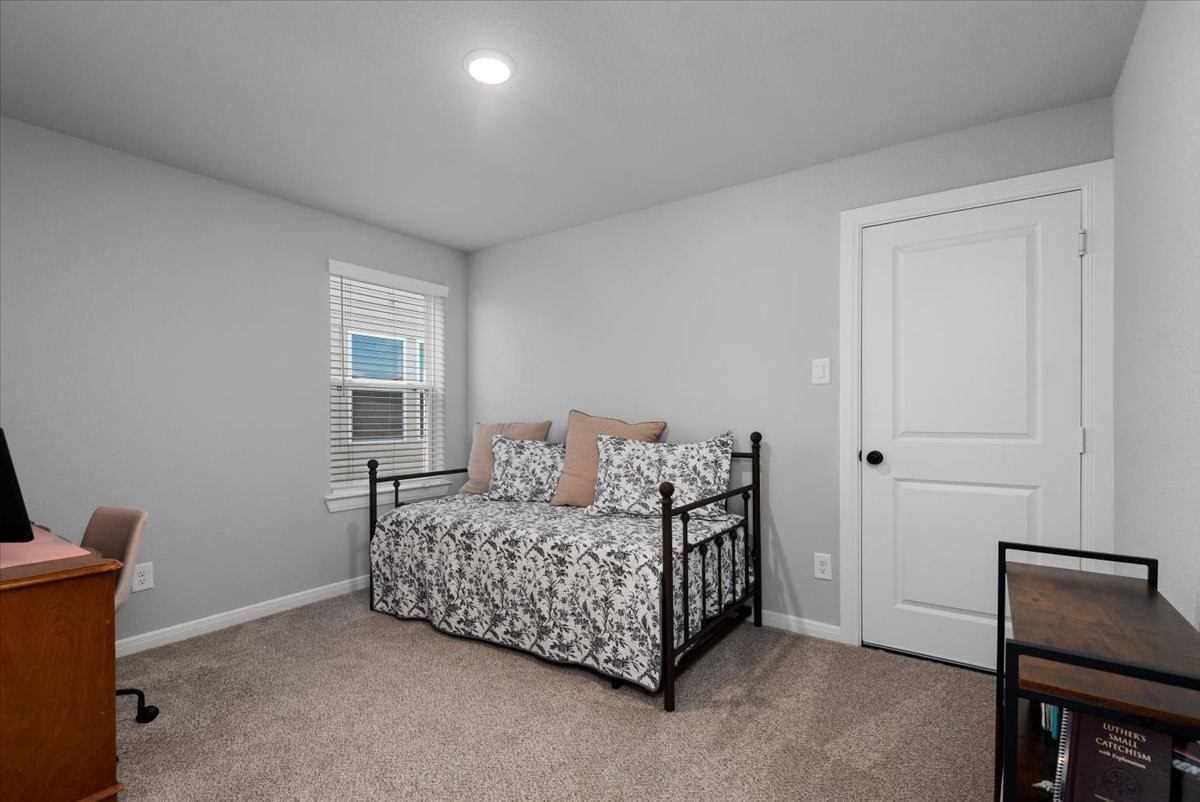27134 Cutleaf Daisy Court Hockley, TX 77447 - Photo 30 of 46 1st guest bedroom located on the 2nd floor. Easy access to your decked attis space through this full sized door.