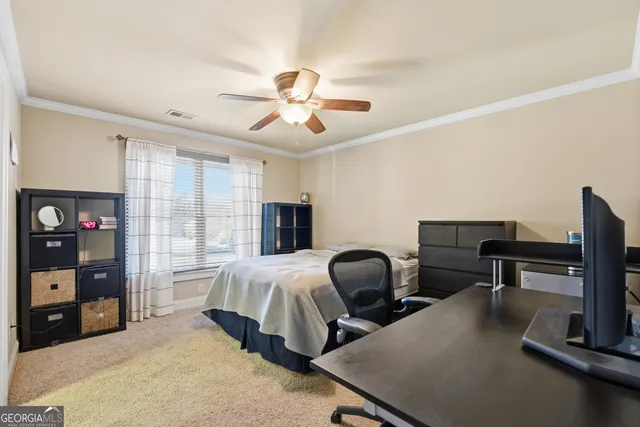 a bedroom with furniture and a window