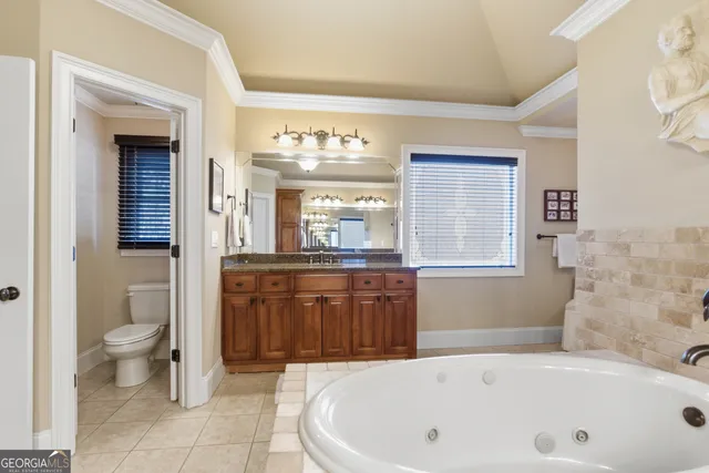 a bathroom with a bathtub sink and toilet