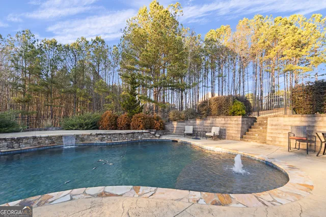 a view of a swimming pool with a patio