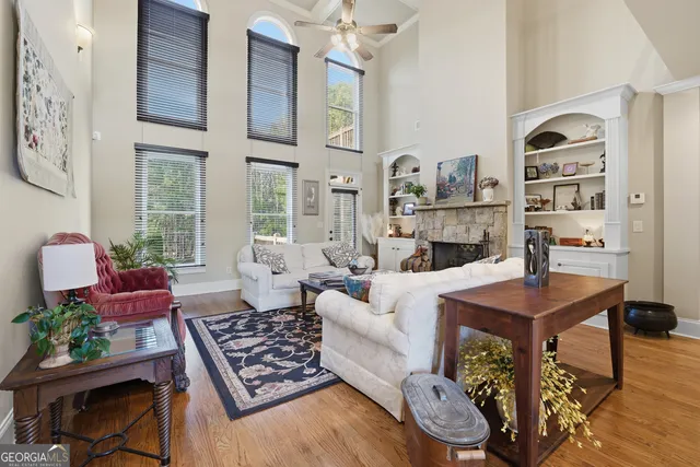 a living room with furniture and a floor to ceiling window