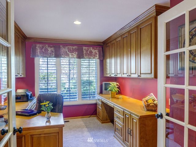 a bedroom with furniture and a window
