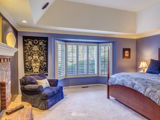 a spacious bedroom with a bed and a couch