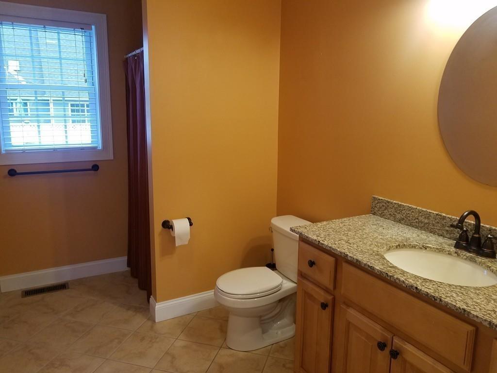 18 Channing Road East Longmeadow, MA 01108 - Photo 20 of 40 a bathroom with a granite countertop toilet and a sink