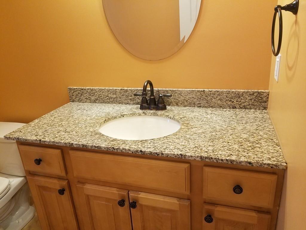 18 Channing Road East Longmeadow, MA 01108 - Photo 21 of 40 a bathroom with a granite countertop sink and a mirror