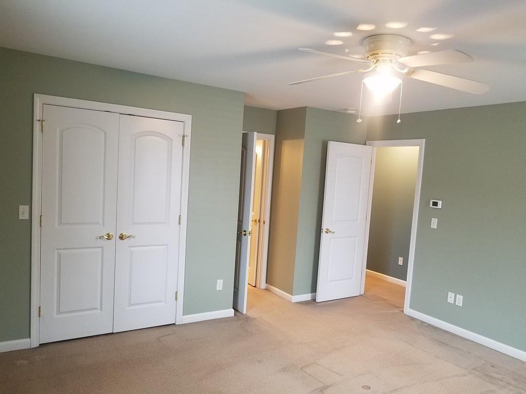 18 Channing Road East Longmeadow, MA 01108 - Photo 23 of 40 an empty room with chandelier fan and bathroom view
