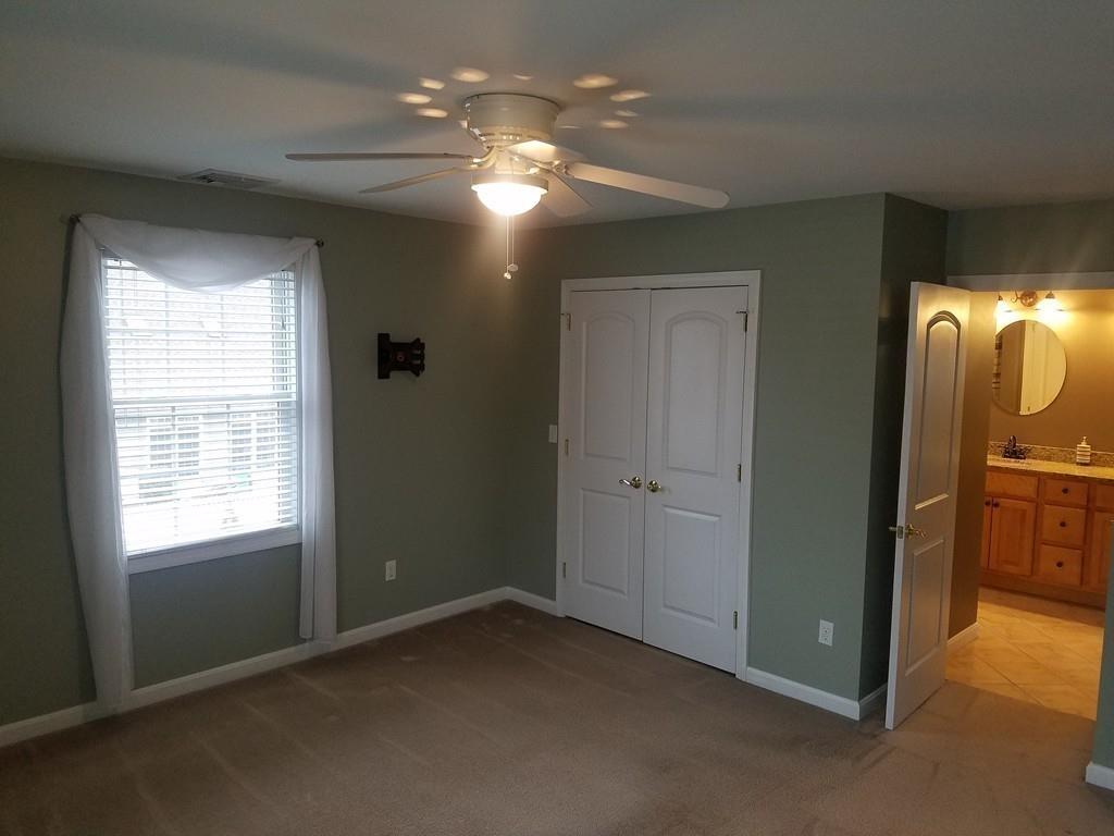 18 Channing Road East Longmeadow, MA 01108 - Photo 25 of 40 an empty room with chandelier fan and windows